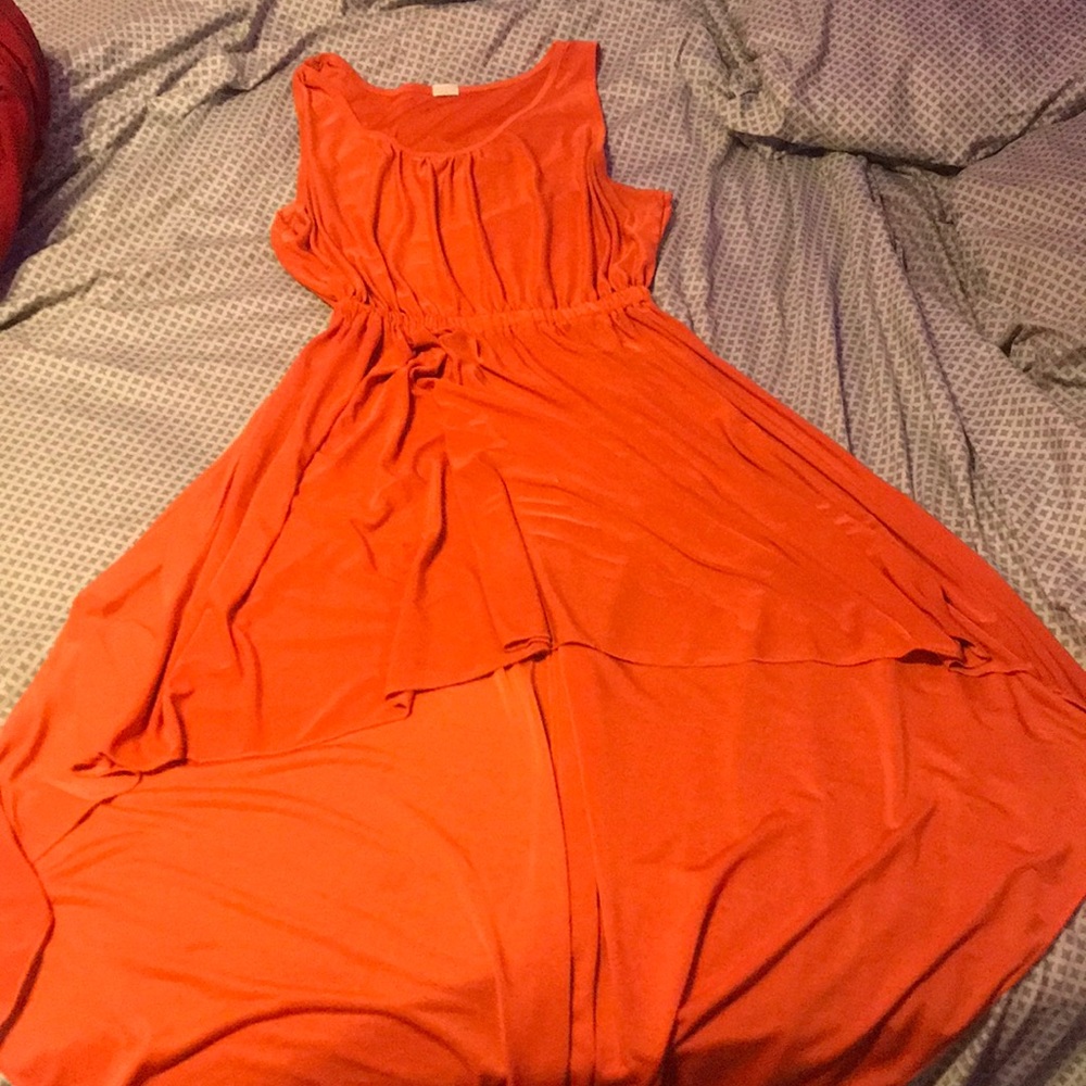 An orange, high- low dress